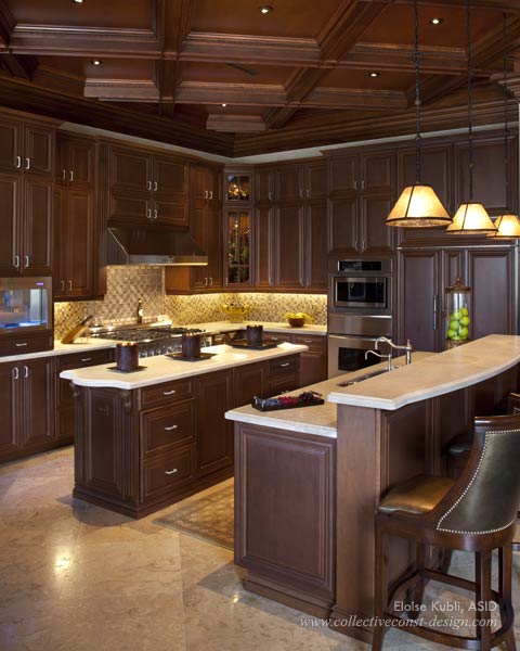 The kitchen ceiling continues the woodbox beam motif that is found throughout the home.
