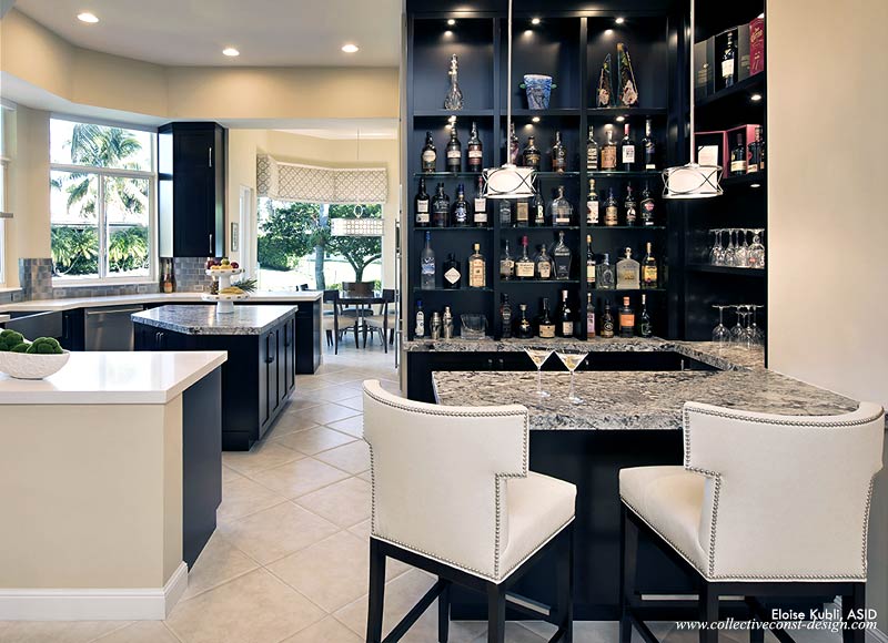 “Custom select maple cabinetry is finished with a dye stain. This produces a clear, consistent espresso color that nevertheless reveals the fine natural grain of the wood,“ explains designer Eloise Kubli. “Azul leathered granite at the bar and island contrast with Cesarstone counters elsewhere in the kitchen. An extensive revision to the layout, including the removal of the pantry, created space for a dramatic display in the bar area adjacent to the living room.”