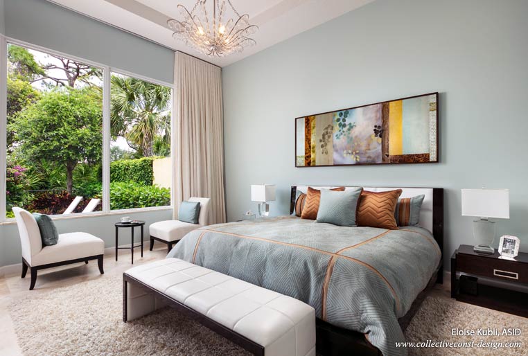 Offering a spa-style retreat, this serene master bedroom uses a softer variation of the of the color pallete applied throughout the home. Original artwork adds to the spaciousnes above the low king headboard.