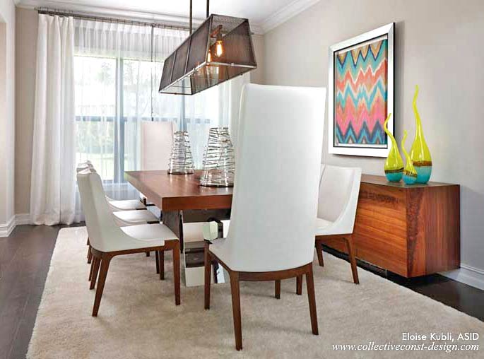 The sensuous grain of the wood on the dining table and console is contrasted by polished stainless steel. The chic white leather chairs, drapery, and rug complement the natural beauty of the exotic wood.