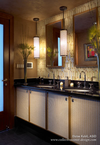 In the Master Bath, the Ann Sacks glass mosaic tile provided the color for the exotic shimmering Lusterstone walls. The soft glow of the twin glass pendants work in harmony within the space to create a peaceful, seductive ambiance.