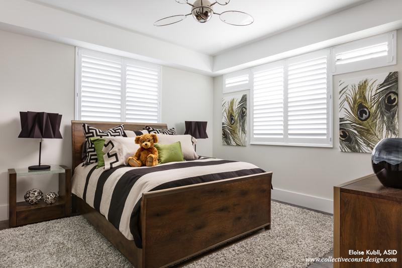 Maple wood furnishings with thick lit-glass night table tops add style. The bedding further increases the designerly appearance of this inviting room for kids, teens, or grown-ups.