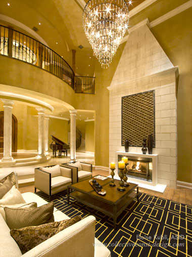 Nothing is more memorable than a dramatic chandelier. This one, custom designed by Wired, hangs gracefully over the living room and is undeniably sensational. Its tiered metal, cone-shaped design carries many dangling crystal pendants that have a mesmerizing effect.