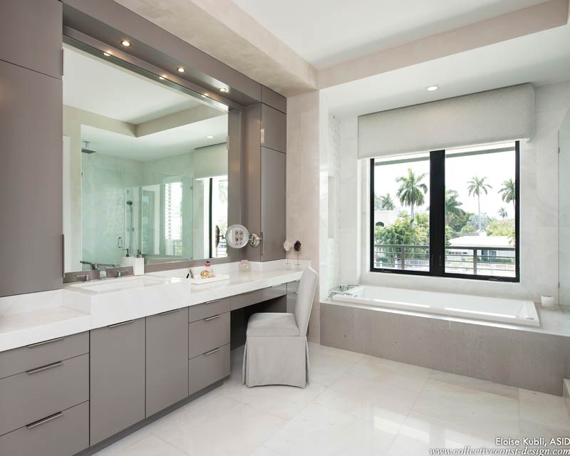 Her personal bath and closet overlooking a Ft. Lauderdale waterway. Serene, spacious, and spa-like, the bath’s luxurious finishes envelope the senses. Cabinetry: KitchenWorks