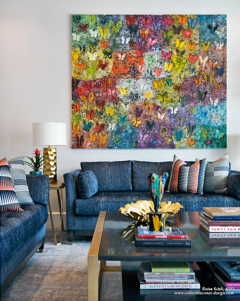 The home owner’s artwork was a determining factor in both the layout and color scheme of the room. Featuring a work from Hunt Slonem’s <em>Butterflies</em> series, Eloise notes that one of her favorite quotes by the artist is “Butterflies are a sign of growth and change.” Privacy and sunlight are controlled by a Crestron motorized roller shade system. An ice blue rug adds texture to the family room’s floor.