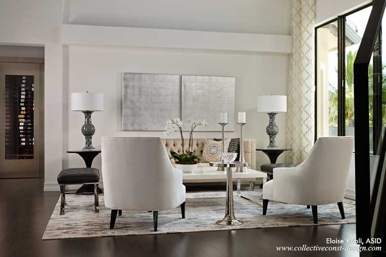 Platinum, silver and polished finishes add interest and sophistication to the living room. The custom wine room on the left has a brushed nickel entry door.