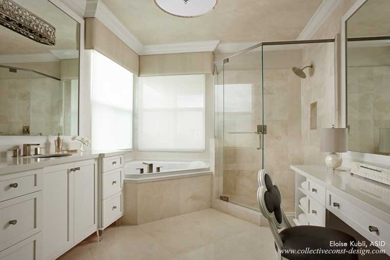 Elegant marble and lacquered cabinetry with crystal hardware give her master bath a sophisticated yet relaxing look.