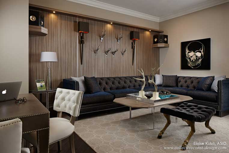 Skull motifs, a game table and tall horn sconces conjure a masculine ambience in the club room.