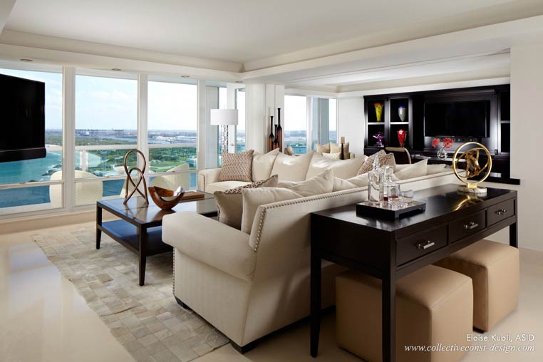 Facing the suspended TV and overlooking the ocean, the family room is a more casual space. A motorized screen divides the space when privacy is desired in the adjacent office.