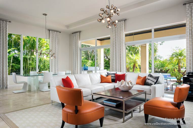 Pinch pleat panels that go all the way to the ceiling are suspended from rings attached to a round rod. (Courtesy of Collective Construction & Design)