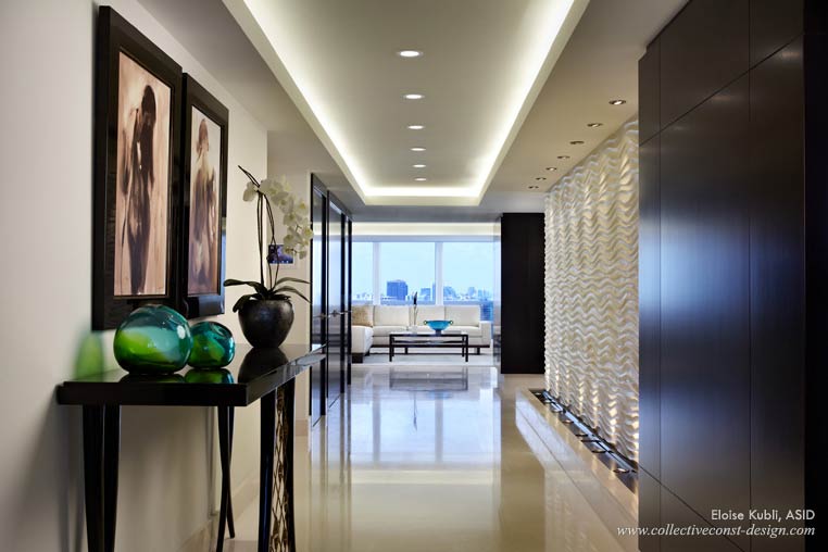 A long, elegant  cove and recessed lights can add ambience to a hallway. (Courtesy of Collective  Construction & Design)