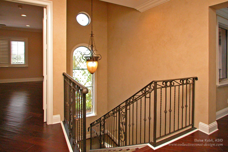 Changing an inexpensive wood stair railing for a metal one can create a richer look in a home. <br /><span class=
