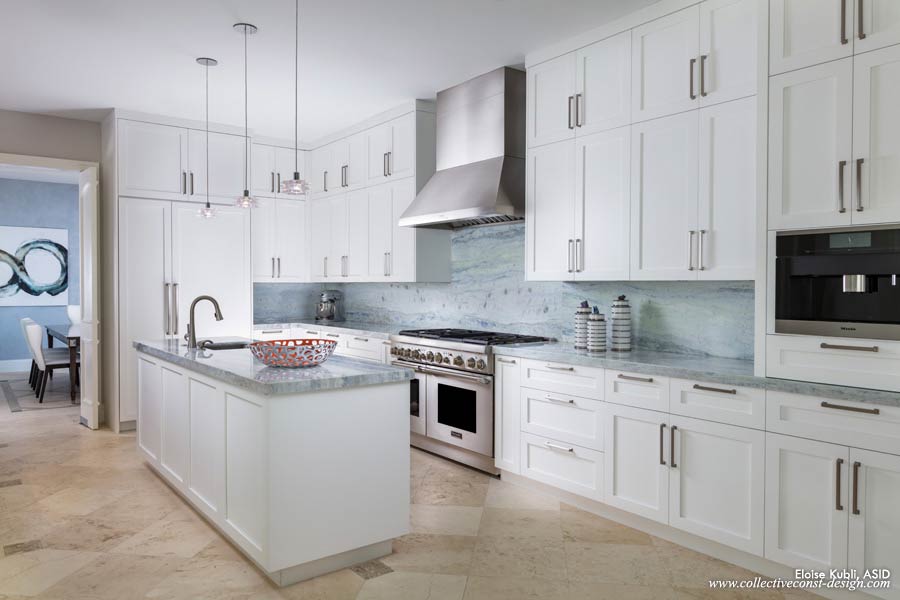 The all-new kitchen with professional-grade appliances is the center of the main home. The blue and green quartzite slabs reference the sea just outside.