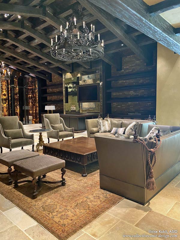 Great room seating area with wine room bar area in the background still under development.